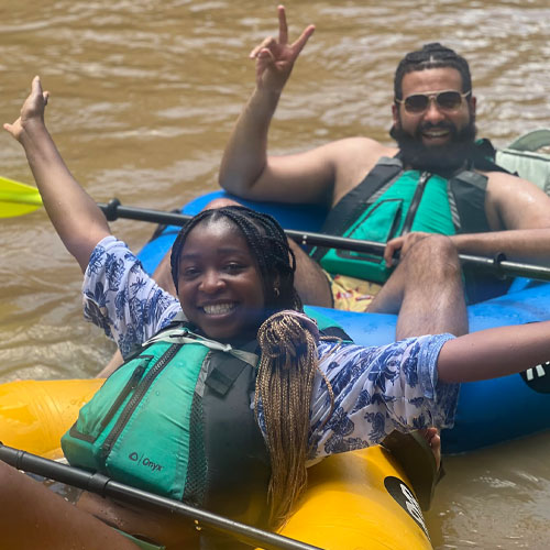 two people enjoying the Asheville tubing experience with Mad Co Tubing